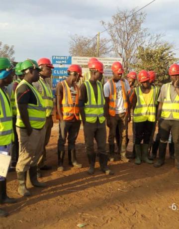 Tool box meeting conducted at Kalya Village in Kigoma region. This meeting is essential for health and safety awareness among team members implementing the project.