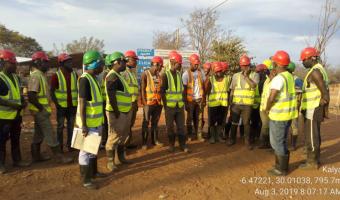 Tool box meeting conducted at Kalya Village in Kigoma region. This meeting is essential for health and safety awareness among team members implementing the project.