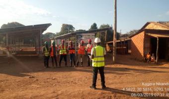 Tool box meeting conducted at Kagera Nkanda Village in Kigoma region where a 40kWp PV plant was under construction. This meeting is essential for health and safety awareness among team members implementing the project